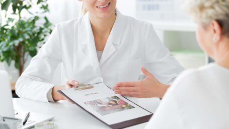 Doctor recommending diet plan to patient during consultation